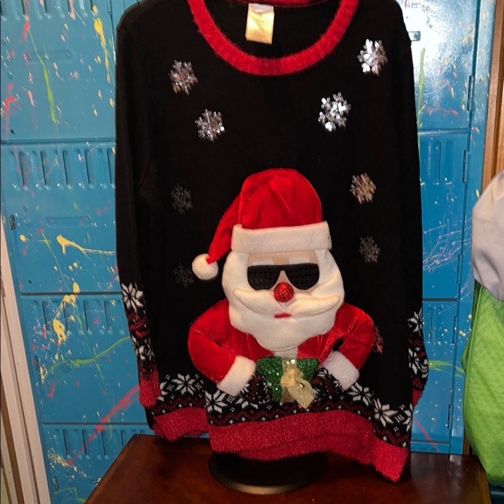 🎄Great Christmas Sweater🎄
Black and Red Crewneck Sweater with Santa Design. B328